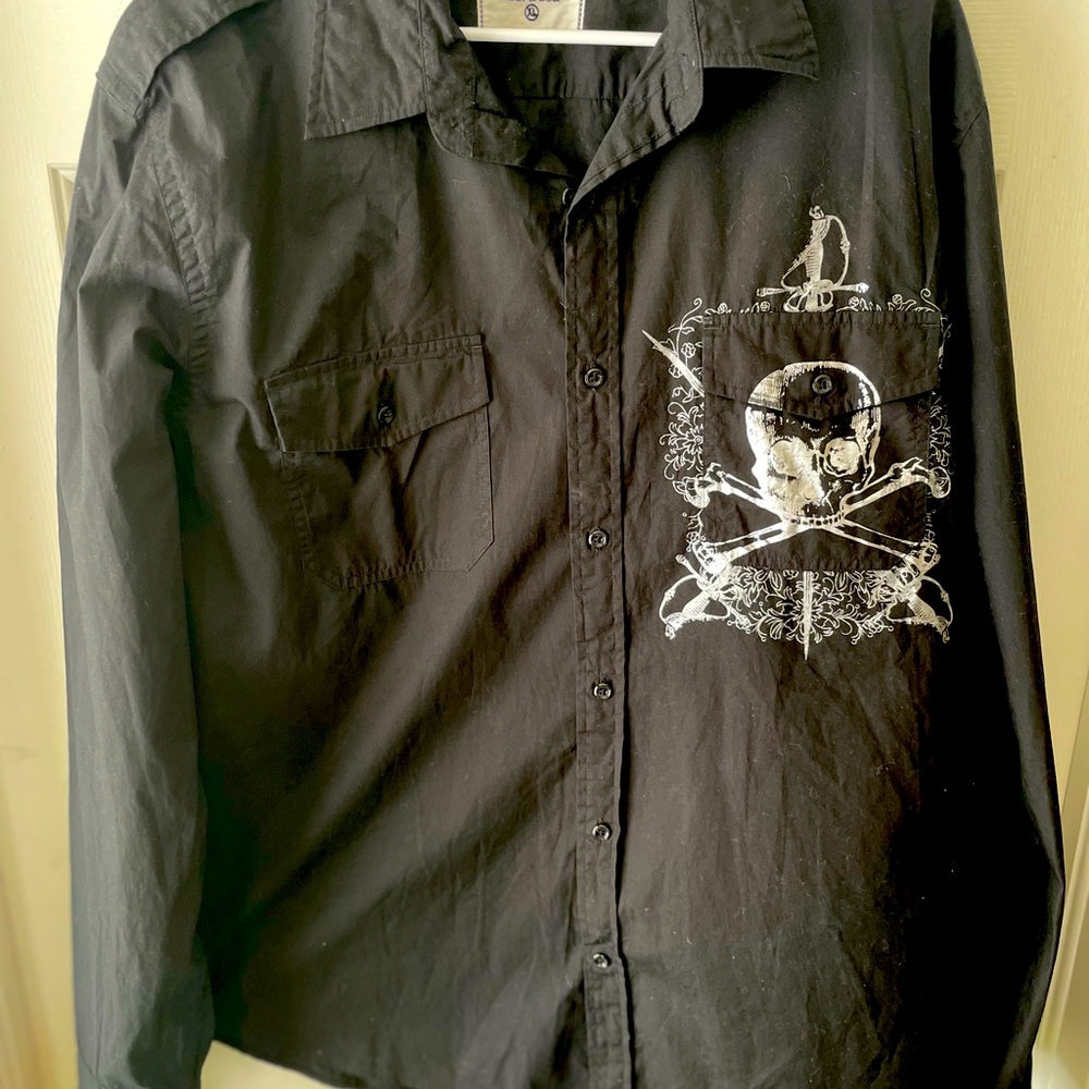 Long sleeve black button down shirt with skull on front pocket and back
